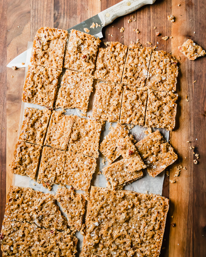 graham cracker toffee on cutting board with large knife