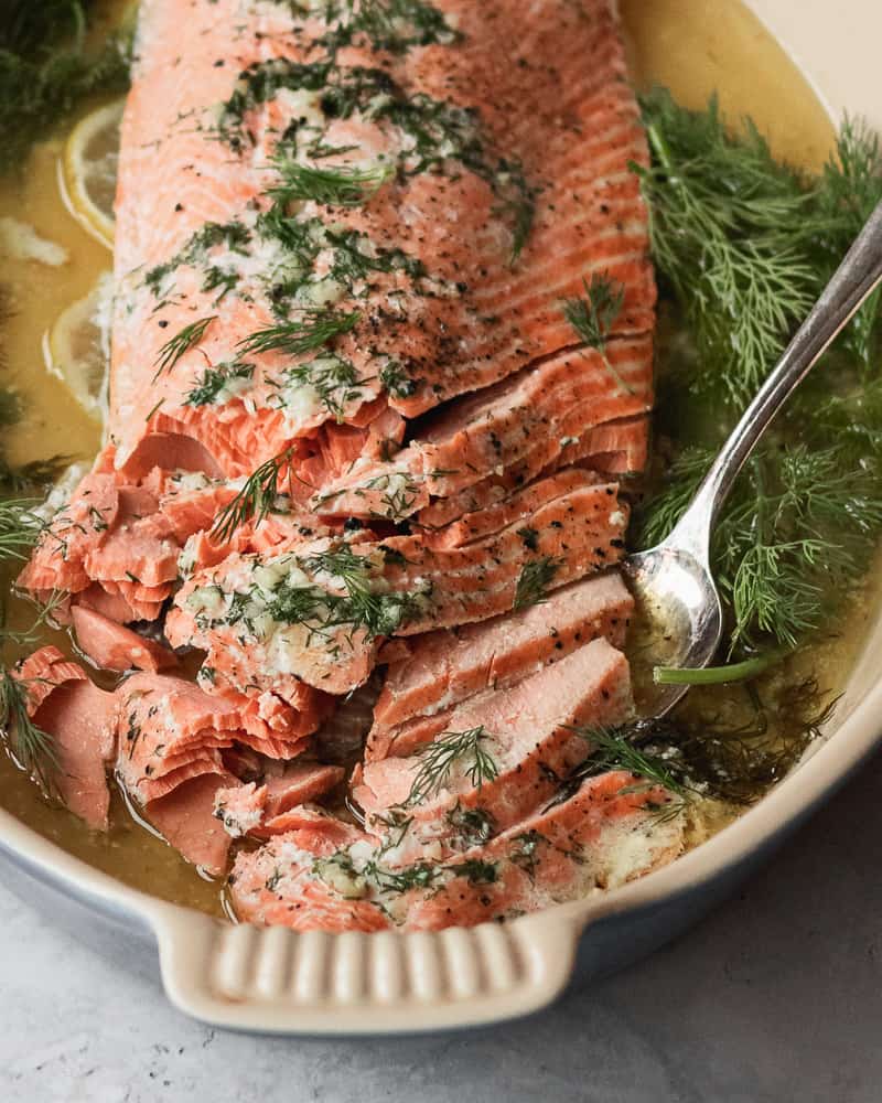Close up of slow roasted salmon in baking dish