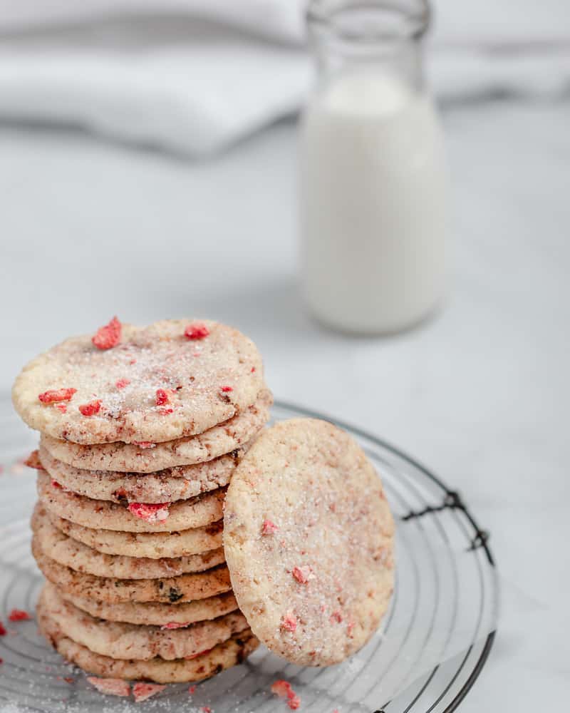 crisp and chewy strawberry sugar cookies on cooling rack