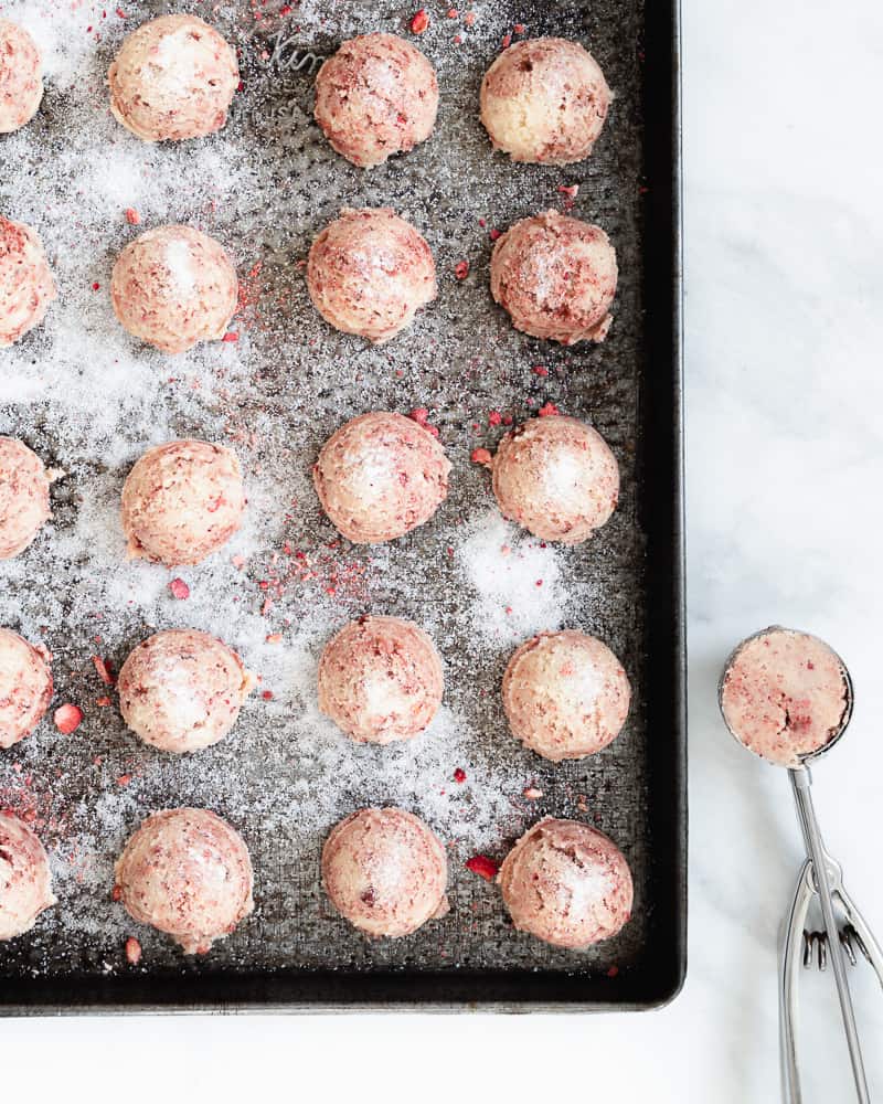 strawberry sugar cookie dough balls on cookie sheet