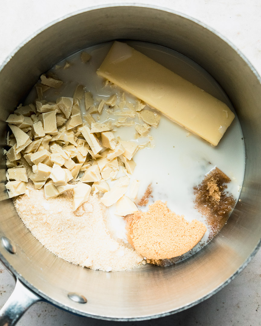 butter, milk, sugars, and white chocolate in pan