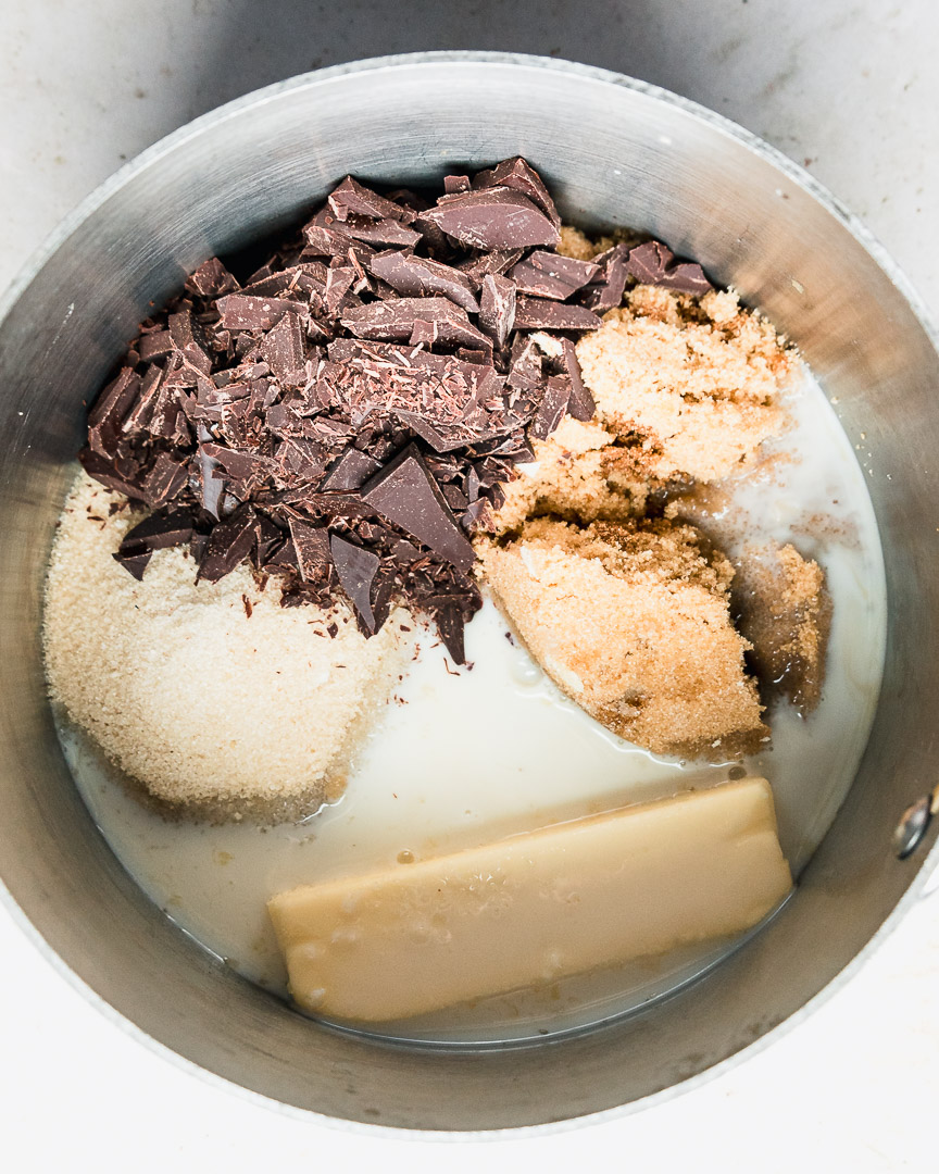 butter, sugars, milk, and dark chocolate in pan