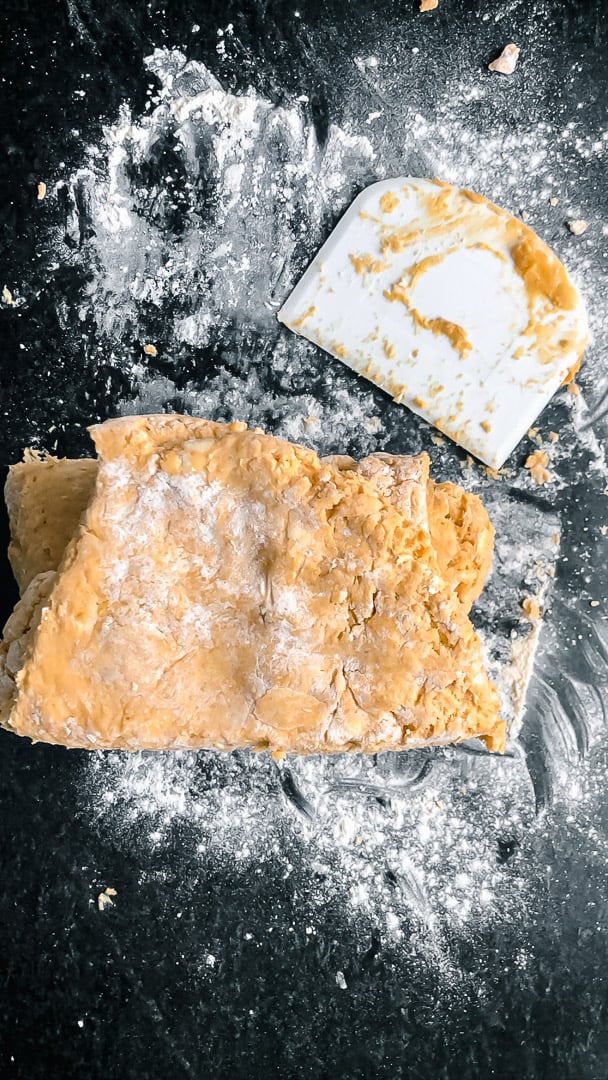 process shot of pumpkin scone slicing and stacking dough