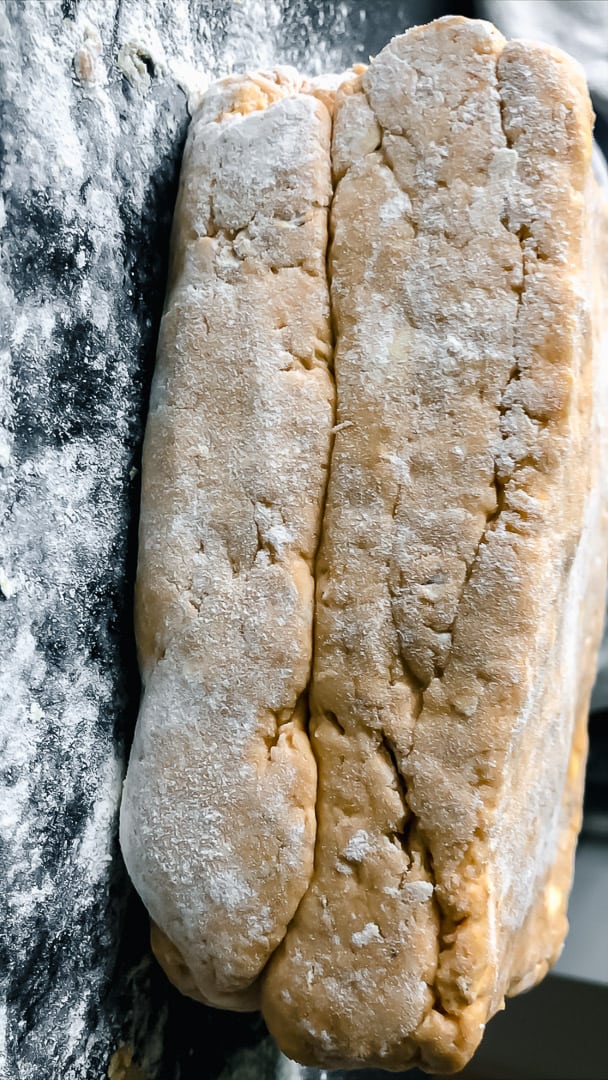 side angle of stacked pumpkin scone dough