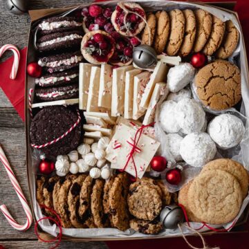box full of a variety of christmas cookies and treats
