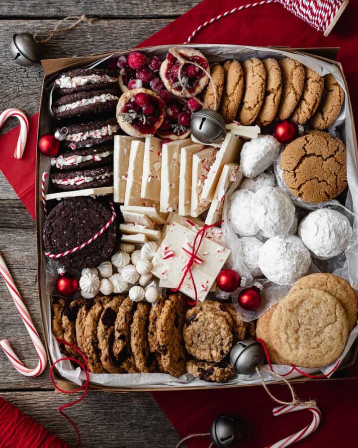 box full of a variety of christmas cookies and treats
