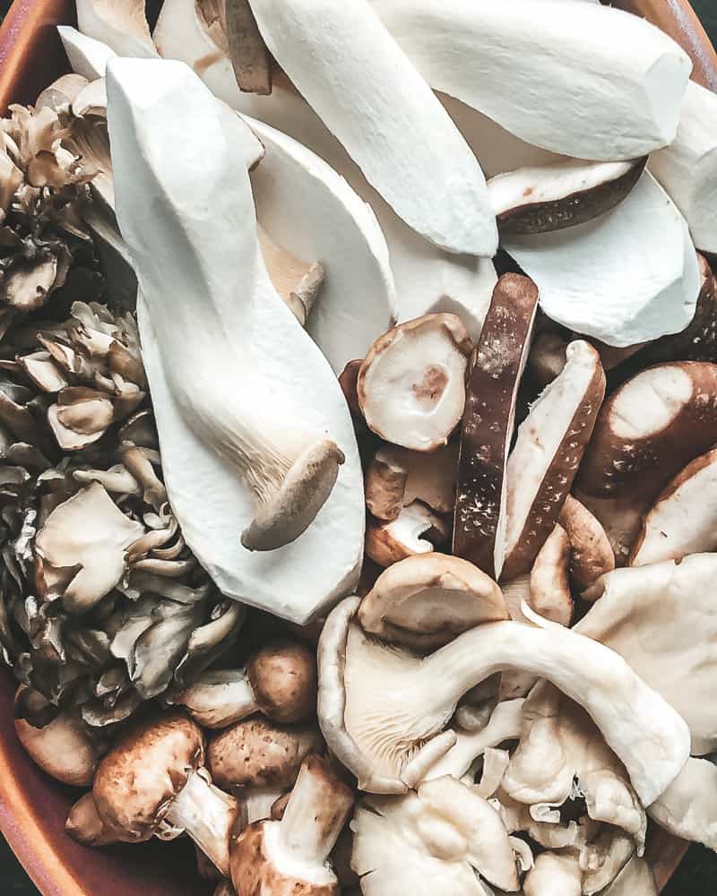 A variety of raw wild mushrooms for oven braised beef brisket recipe