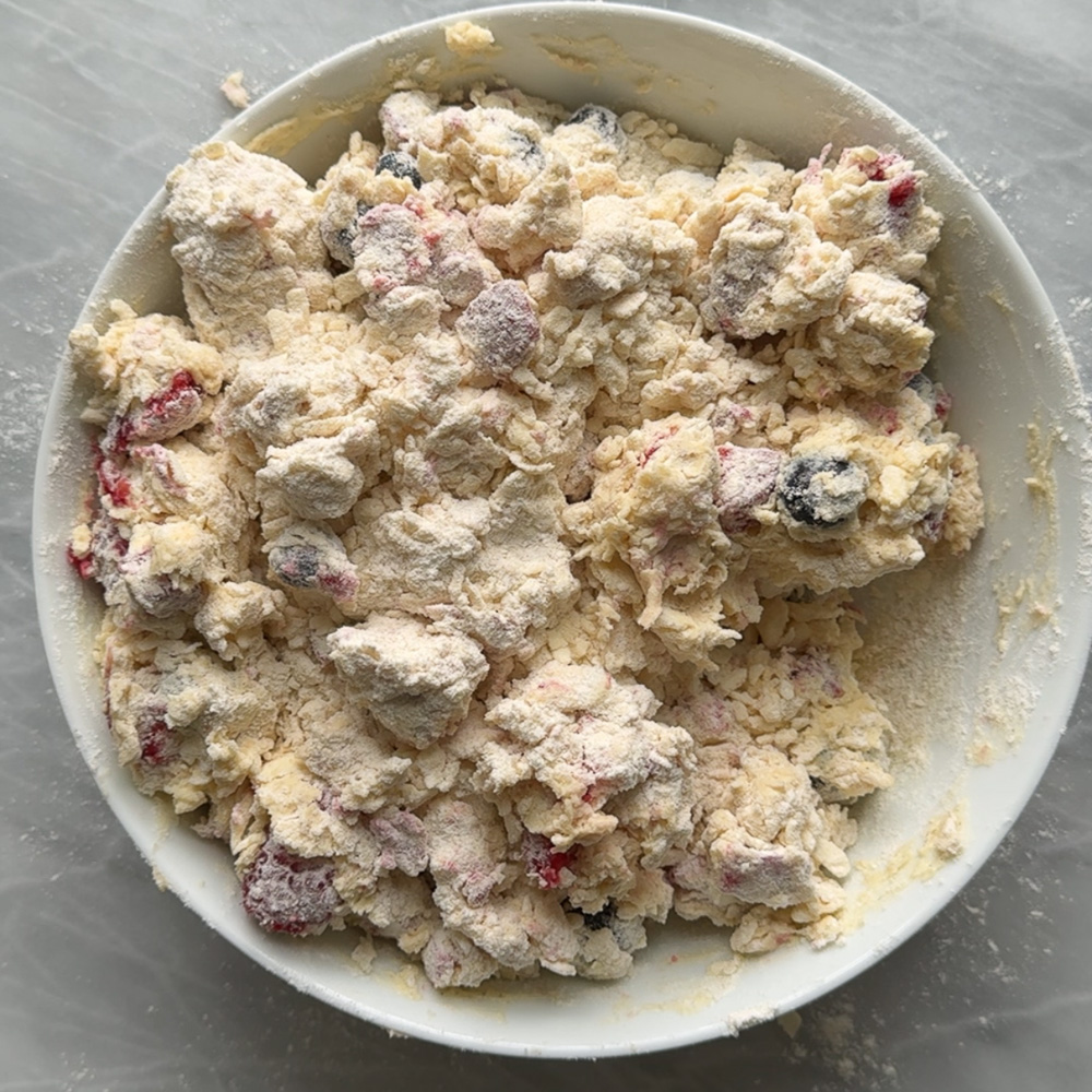 shaggy scone dough in white bowl