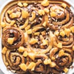 Baked Peach Pecan Sticky Buns topped with fresh peaches