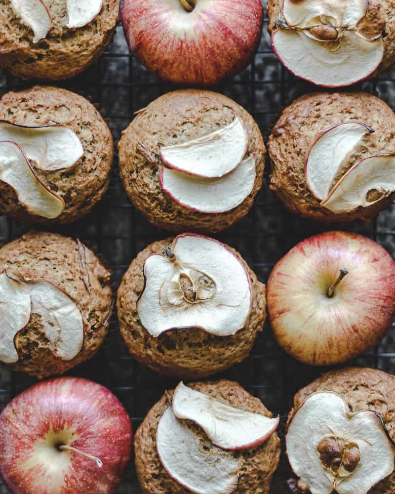 overhead of apple butter muffins topped with thin apple slices