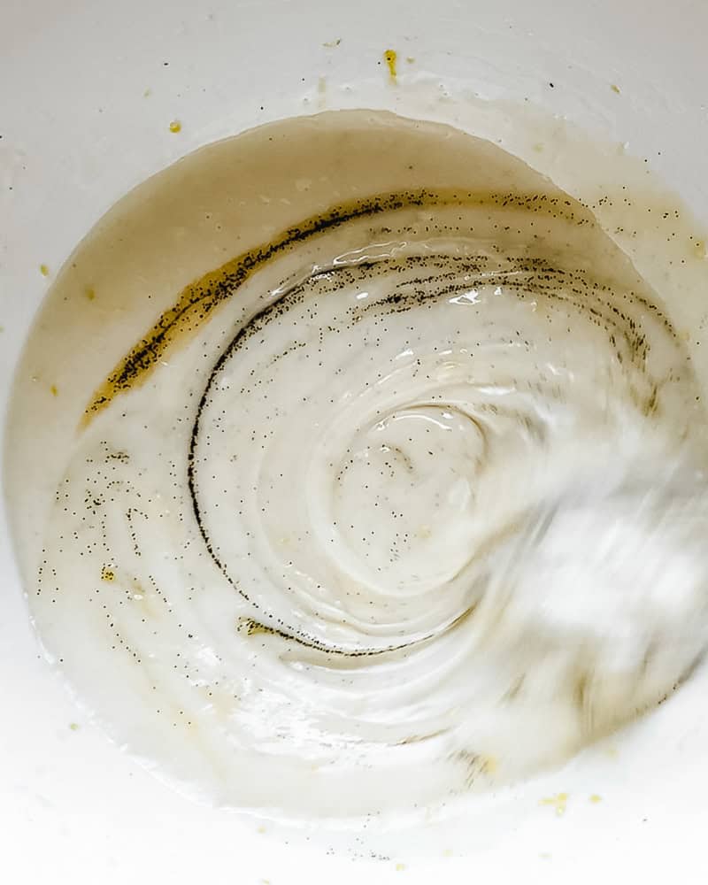 Vanilla bean seeds swirled in glaze
