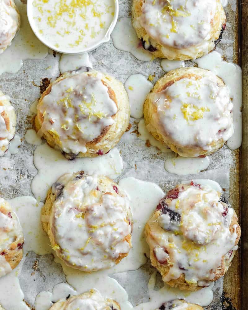 overhead image of glazed scones on parchment lined baking tray