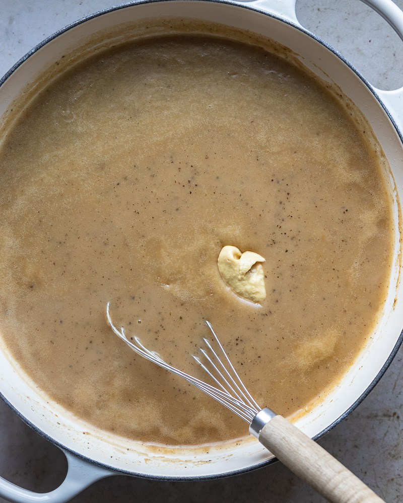 finished white wine gravy with spoonful of dijon added