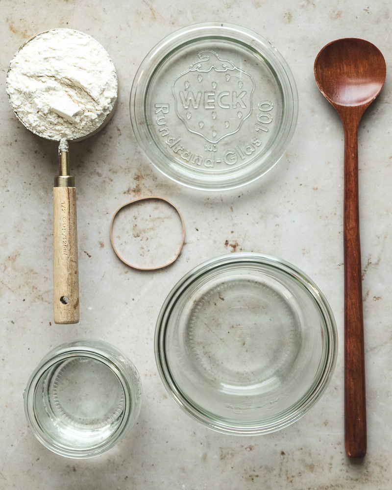 ingredients and equipment needed to create a sourdough starter