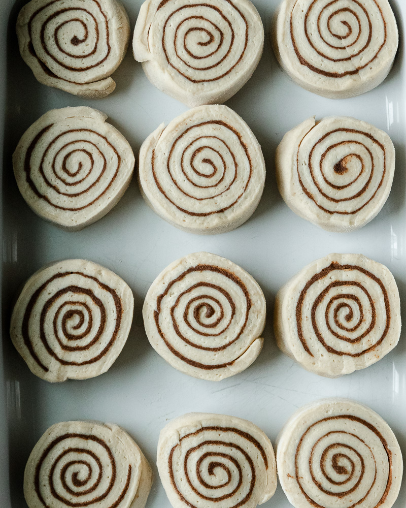 12 cinnamon roll slices in pan before second rise