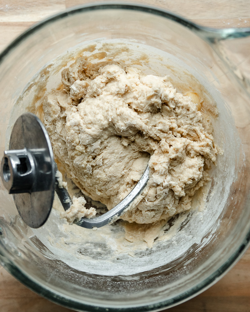 shaggy cinnamon roll dough formed in mixing bowl