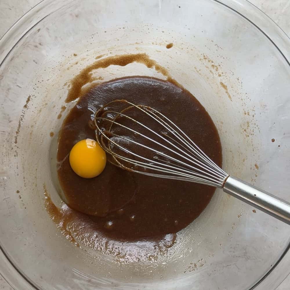 egg added to brown sugar and butter mixture