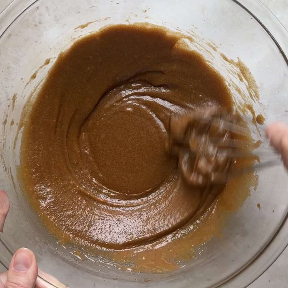 batter for sourdough blondies being whisked until creamy in large glass bowl