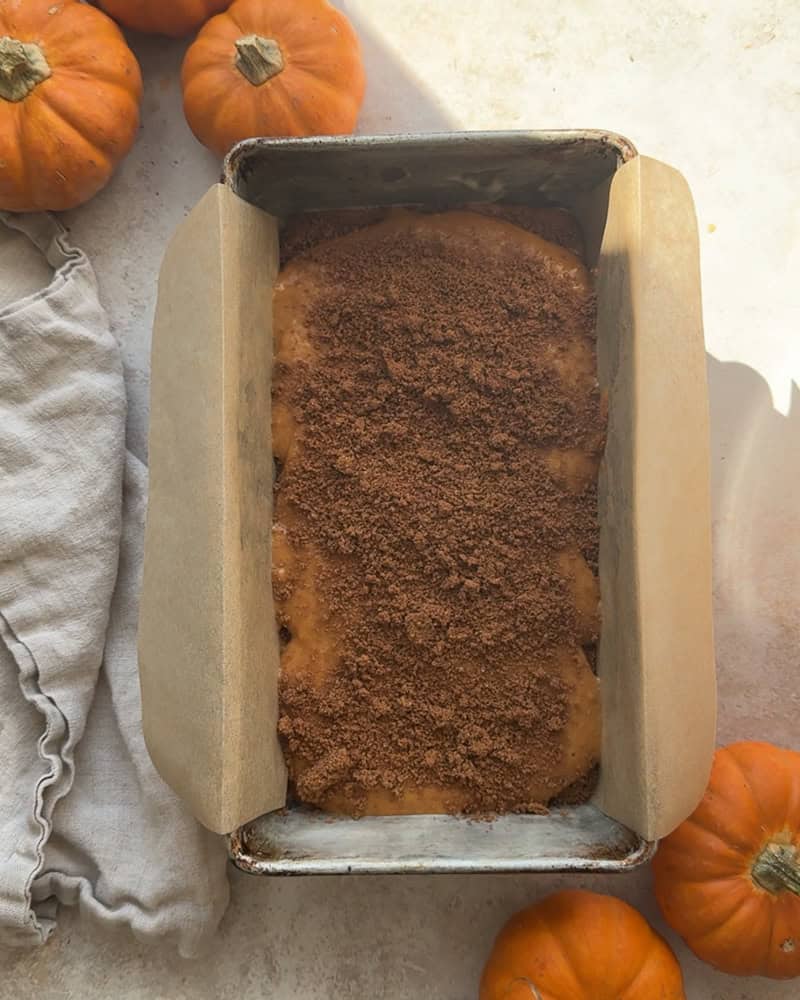 another later of cinnamon sugar placed on second layer of batter