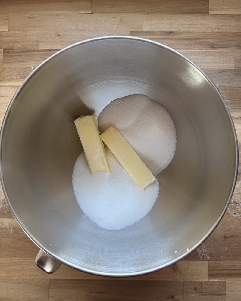 butter and sugar in metal mixing bowl