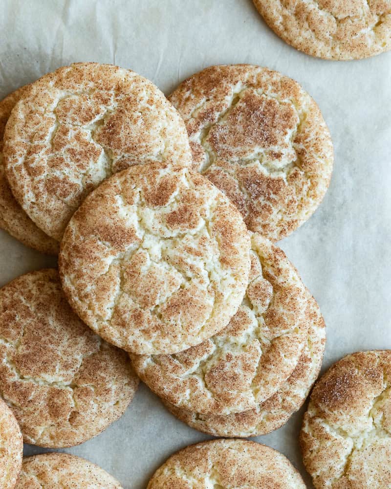 an overhead image of cookies on a piece of parchment paper
