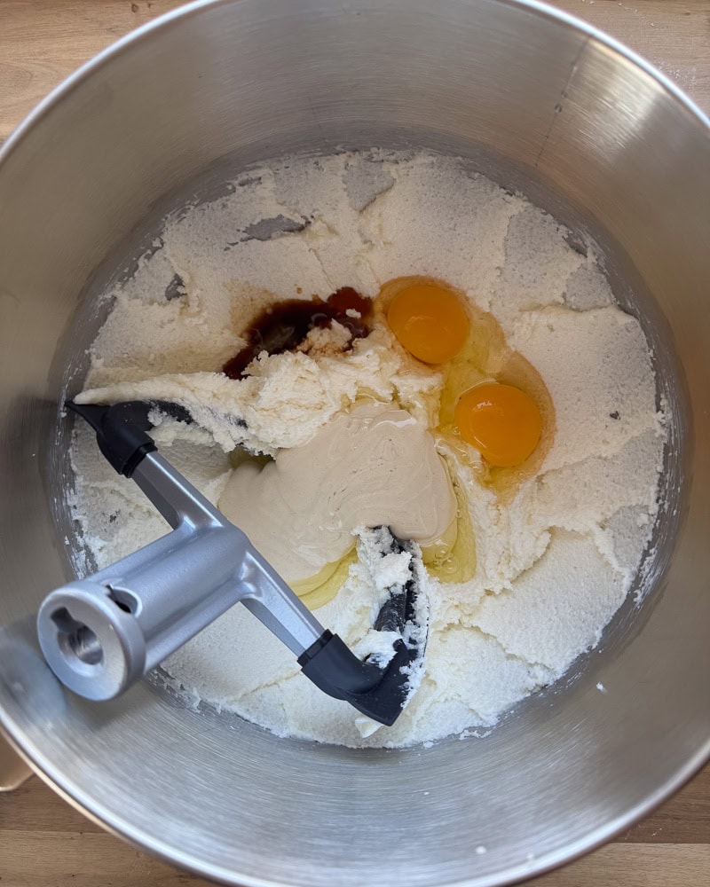 eggs, vanilla, and sourdough starter added to creamed butter and sugar mixture