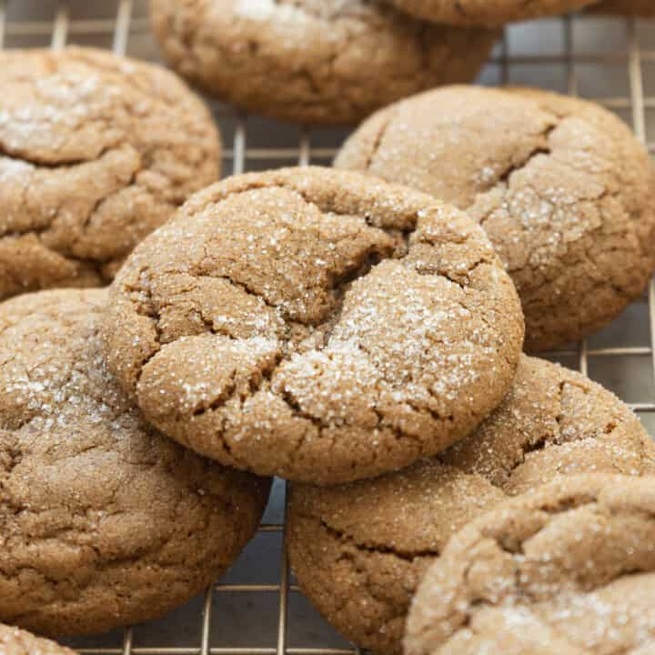 sourdough ginger molasses cookies on a gold cooling rack