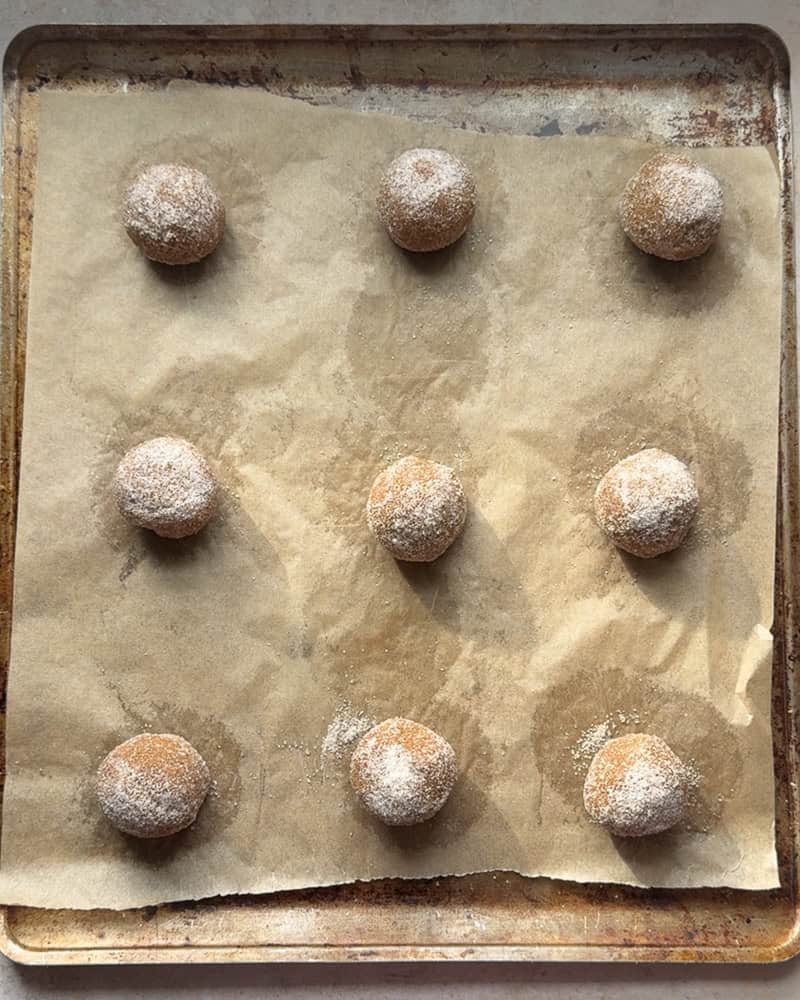a tray of nine cookie dough balls