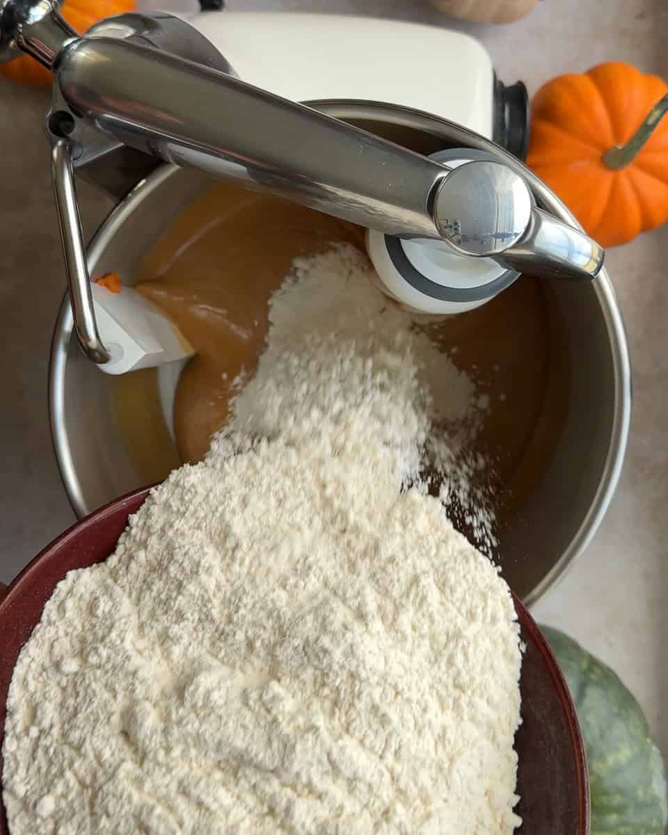 Flour being added to mixer bowl