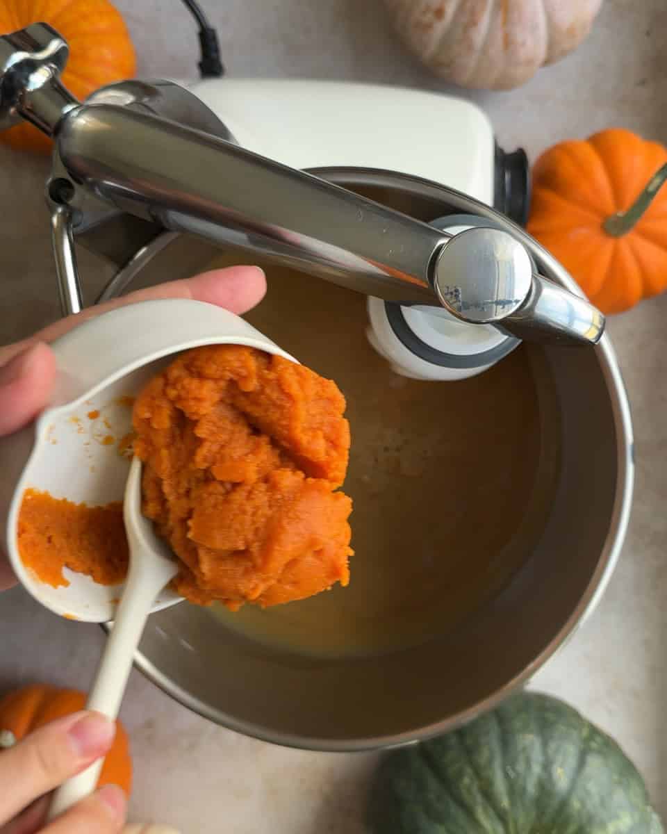 pumpkin puree added to wet mixture in mixer