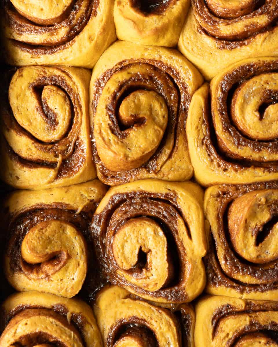 a pan of unfrosted pumpkin cinnamon rolls
