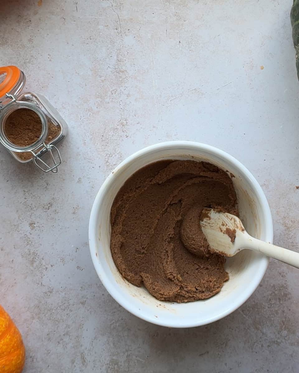 cinnamon roll filling mixed together in small white bowl