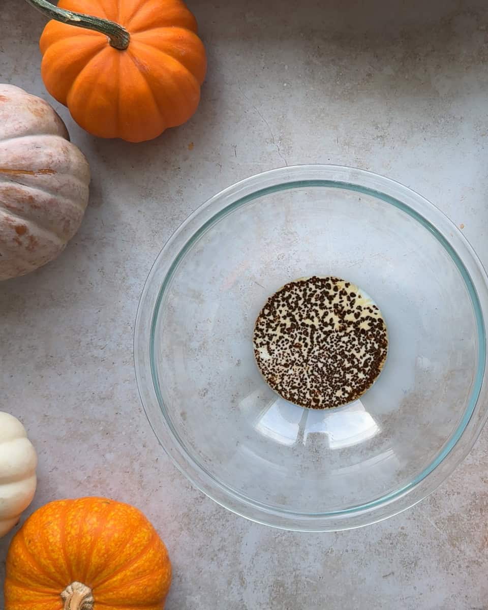 milk and espresso powder in a glass bowl