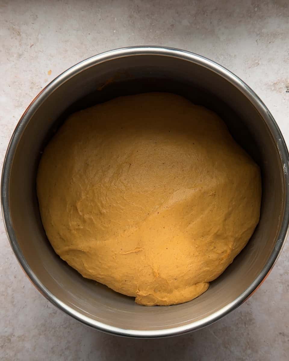 pumpkin cinnamon roll dough after rising and doubling in size