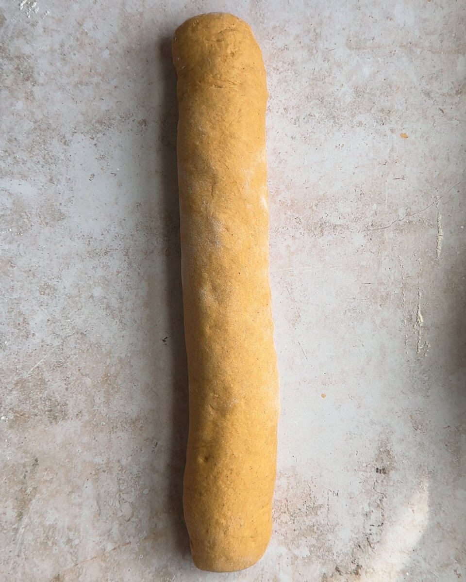 cinnamon roll dough rolled into a long log
